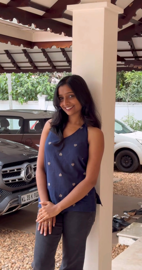 A handloom short top crafted from lightweight woven fabric, featuring a relaxed silhouette and subtle woven motifs.