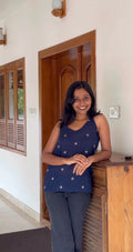 A handloom short top crafted from lightweight woven fabric, featuring a relaxed silhouette and subtle woven motifs.